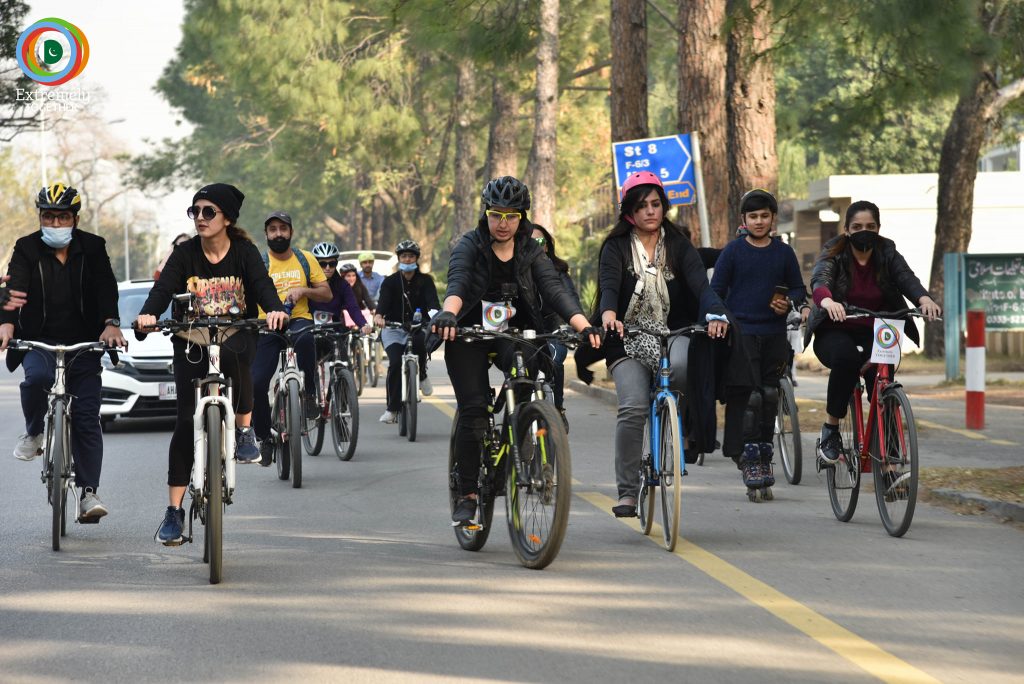 Women taking part in cycling rally in Pakistan- a campaign to prevent violent extremism led by a woman in Pakistan