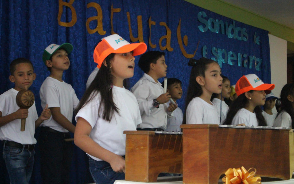 Young children from Colombia singing during a music class