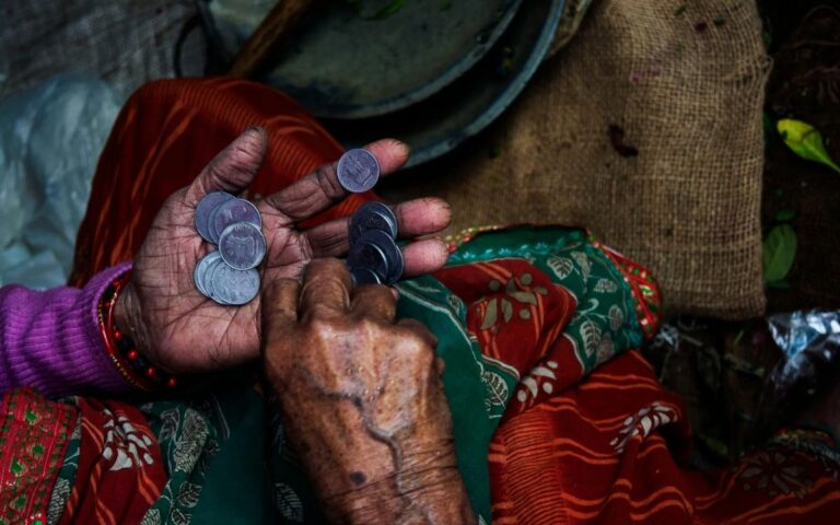 Person Holding Coins