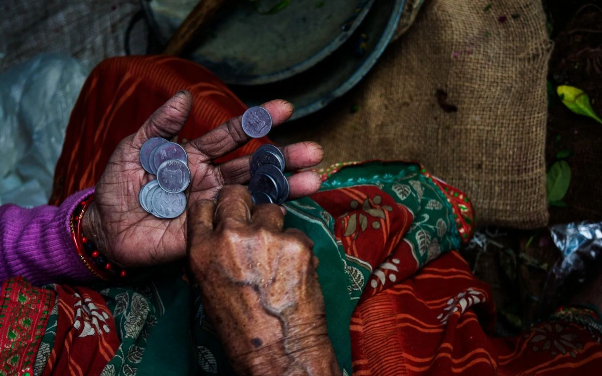 Person Holding Coins