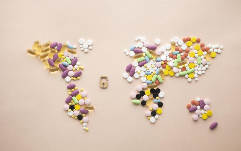Free World map made of tablets and capsules and little lock Stock Photo