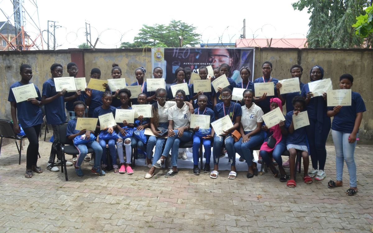 Nigerian girls showing a certificate