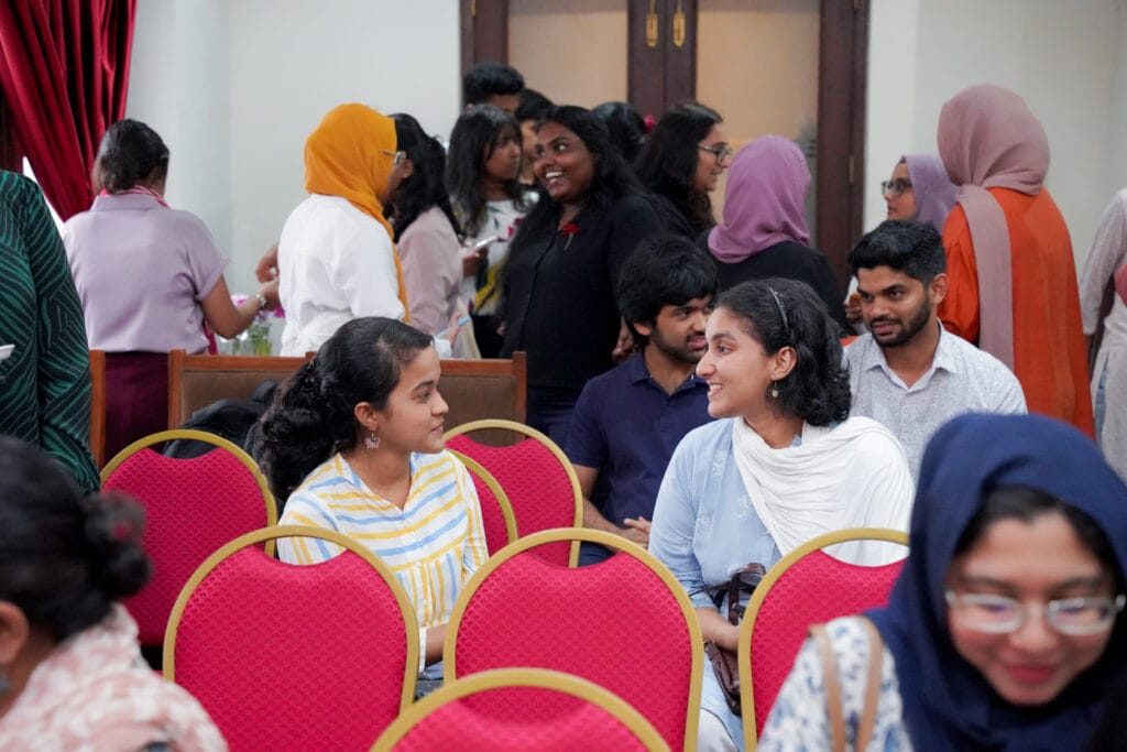 Two young women talking to one another